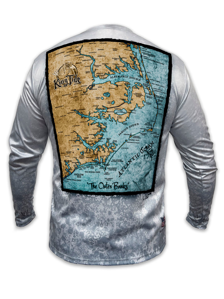 Long-sleeve shirt with OBX map on the back against a slate fossil background.
Cape Hatteras, Kill Devil Hills, Nags Head, Corolla Beach, Kitty Hawk, Okracoke and lighthouses of the barrier islands are just a few of the historic locations on this OBX custom, fine art map.
