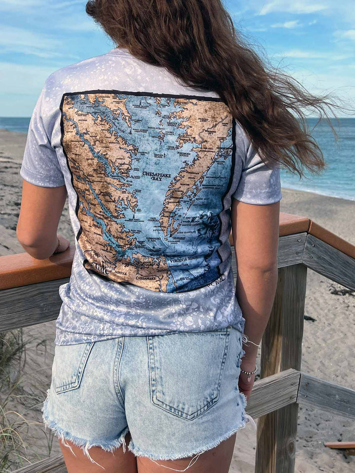 Vintage style map of Chesapeake Bay, VA on back of short sleeve performance shirt with slate fossil allover print. UPF 50. XS-4X. Made in USA. Original art and design by Tal Willis.
