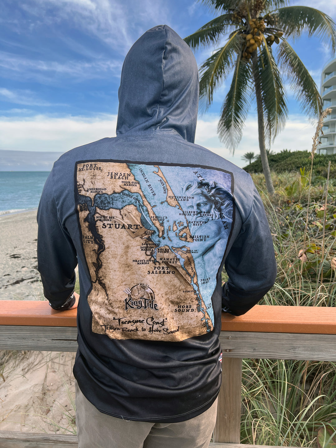 Vintage style Stuart, FL coastal map on back of serene black performance hoodie.  Double lined hood. UPF50. Unisex. XS-4X. Made in USA. Original art and design by Tal Willis.