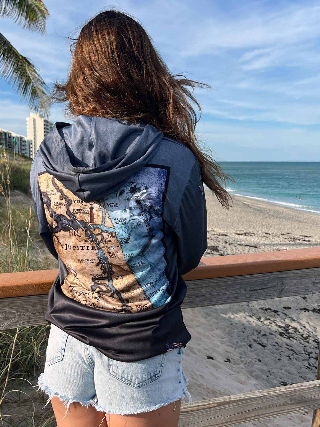 Vintage style Jupiter, FL coastal map on back of serene black performance hoodie.  Double lined hood. UPF50. Unisex. XS-4X. Made in USA. Original art and design by Tal Willis.
