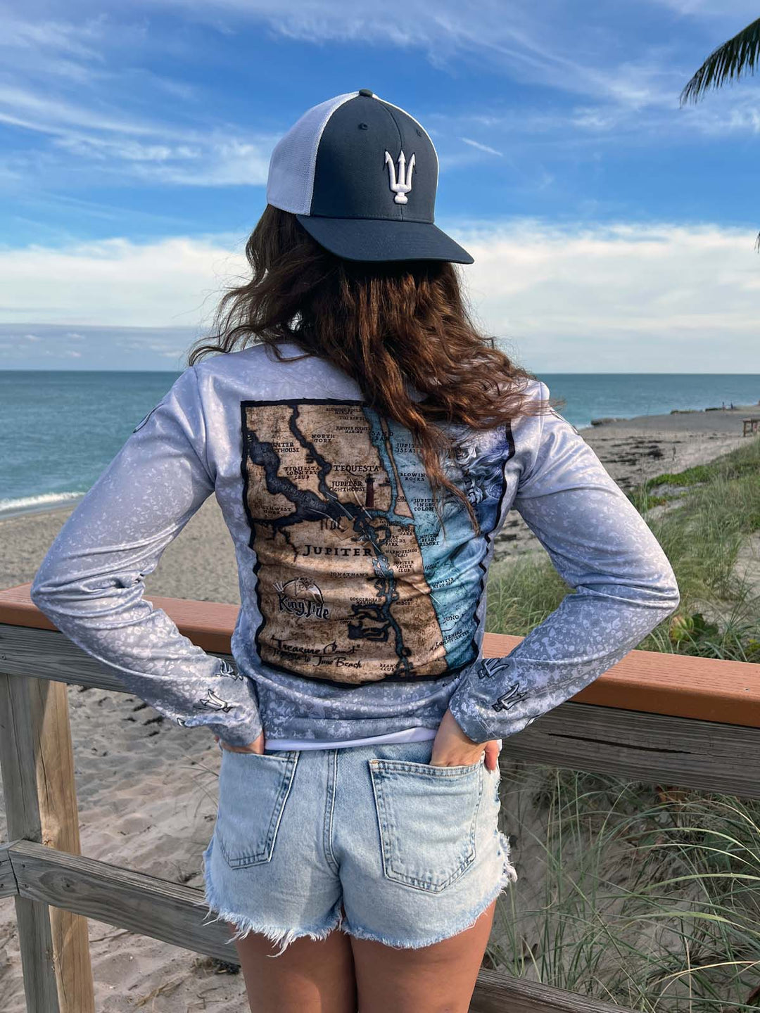 King Tide long sleeve performance shirt in serene black.  Back side features vintage style map of coastal Jupiter, FL. UPF50 XS-2X Made in USA. Original artwork and design by Tal Willis.
