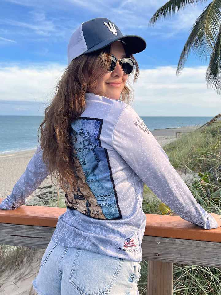 King Tide long sleeve performance shirt in serene black.  Back side features vintage style map of coastal Jupiter, FL. UPF 50. XS-2X . American flag 'Made in America' on bottom back right. Original artwork and design by Tal Willis