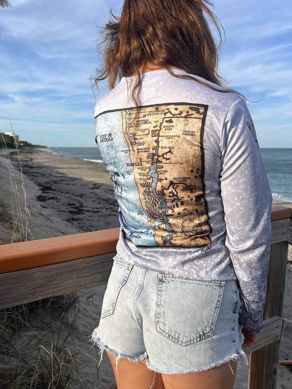 Long sleeve, slate fossil  print performance shirt. Back side displays weathered Naples, FL coastal map. XS-2X