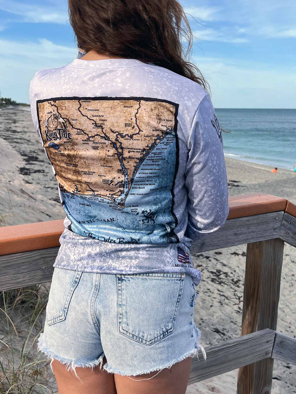 Vintage style Grand Strand map on back of long sleeve performance shirt with slate fossil allover print. UPF 50. XS-2X. Made in USA. Original art and design by Tal Willis.
