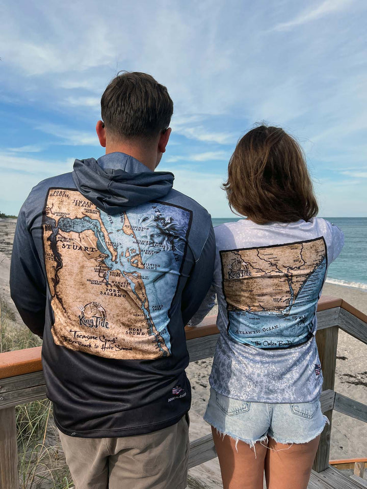 Vintage style Stuart, FL coastal map on back of serene black performance hoodie.  Double lined hood. UPF 50. Unisex. XS-4X. Made in USA. Original art and design by Tal Willis.
