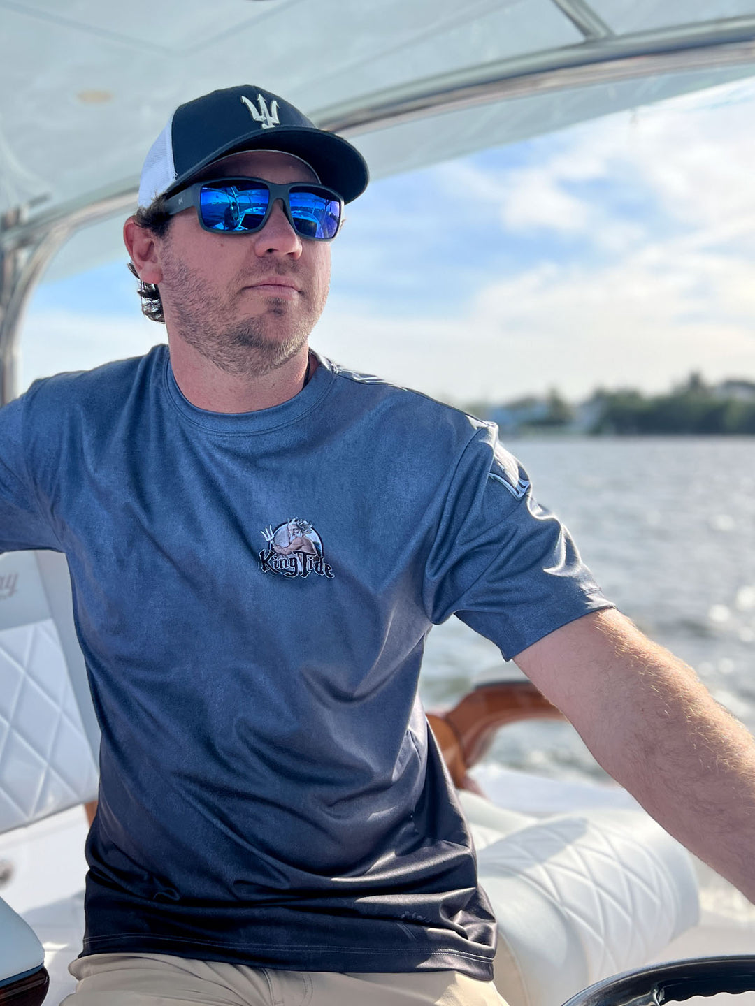 Short sleeve, serene black allover print performance shirt. Front shows King Tide logo on left chest. UPF 50. XS-5X. Made in USA. Original art and design by Tal Willis. 