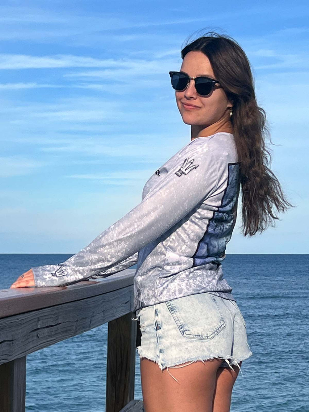 Long sleeve performance shirt with slate fossil, allover print.  Front side showing tridents on sleeves at shoulders and wrists. UPF 50. XS-2X. Made in USA. Original art and design by Tal Willis.