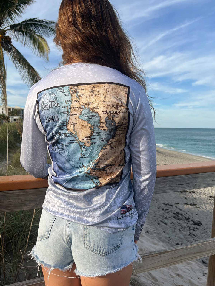 Vintage style Tampa, FL coastal map on back side of long sleeve performance shirt with an allover slate fossil print. UPF50. XS-2X. Made in USA. Original art and design by Tal Willis
